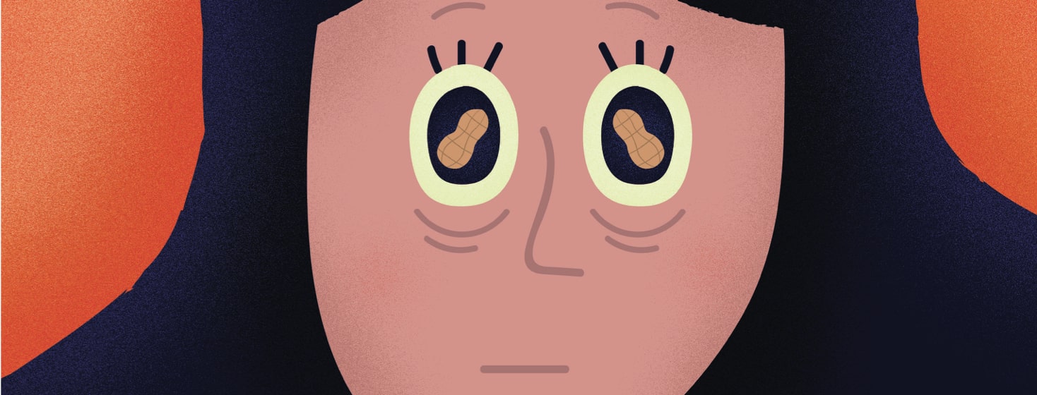 a woman with peanuts in her eyes looking concerned