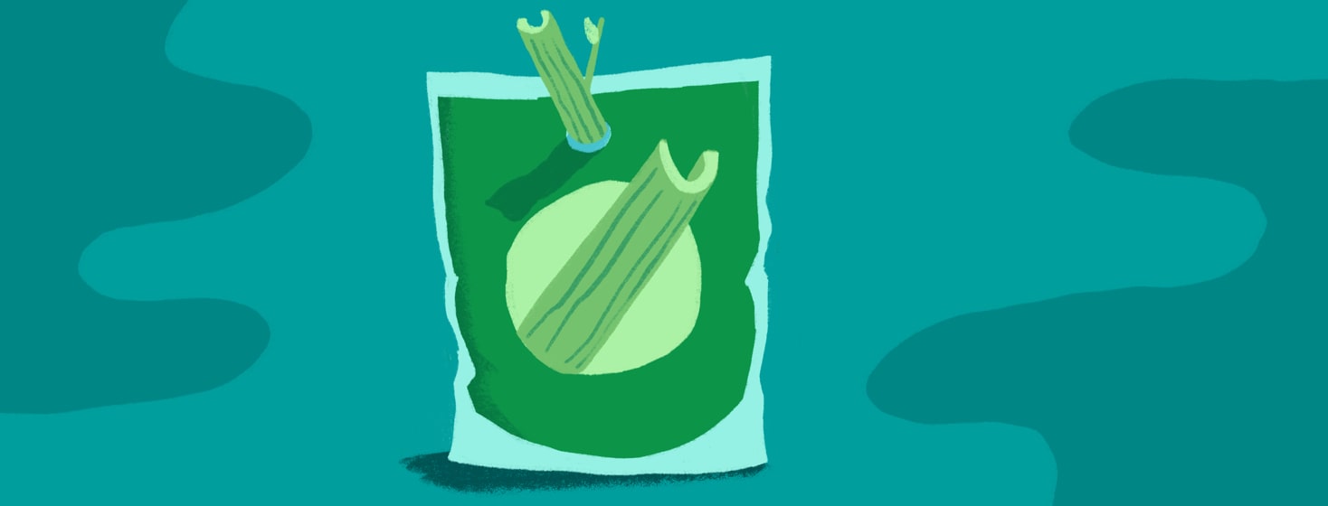 a juice pouch of celery juice with a celery straw