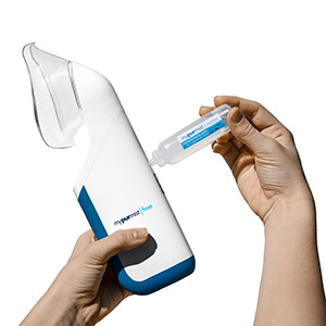 One hand holding a MyPurMist cordless, germ-free, personal steam inhaler and the other hand refilling the device with sterile water.
