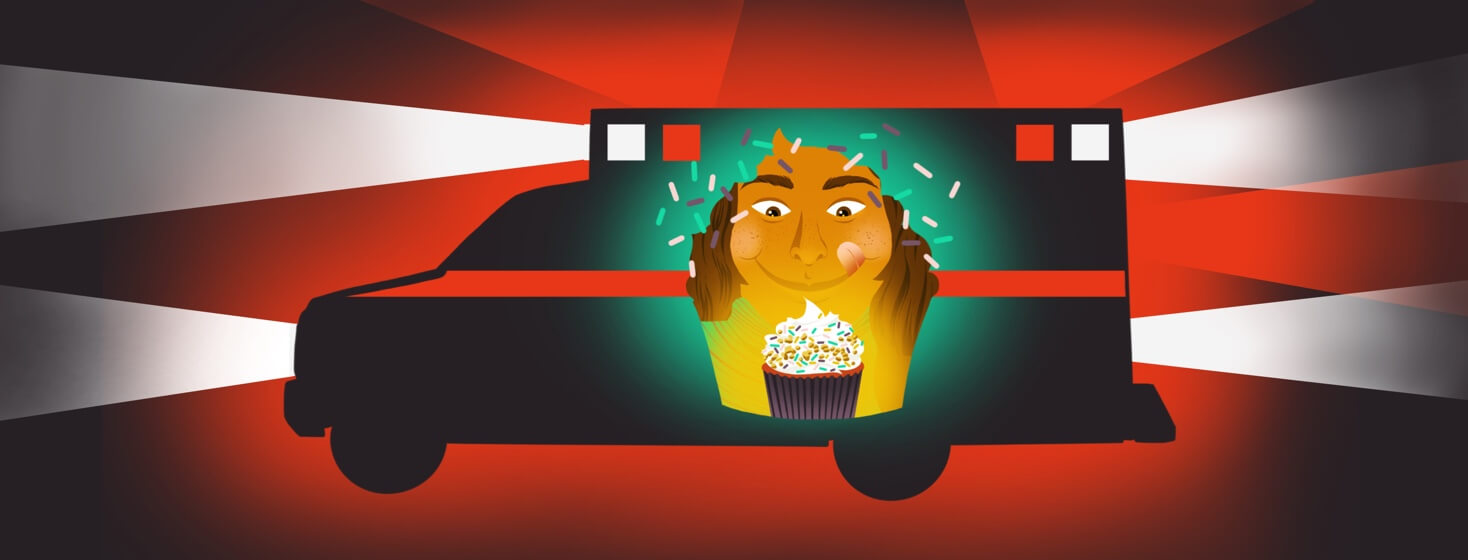 alt=A girl smiling at a cupcake; an ambulance with emergency lights flashing